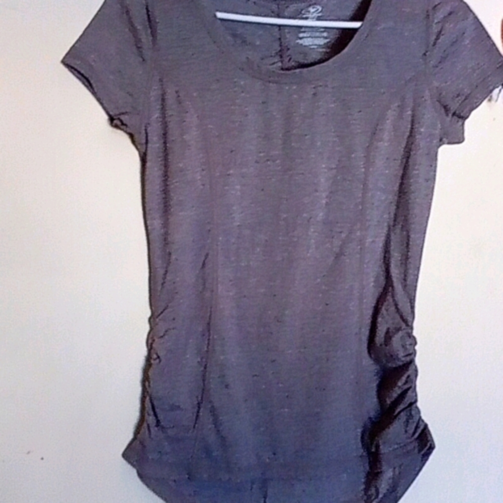 Women's blouse with gathering on the sides & back.